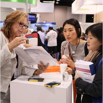 clinicians networking with an industry representative at a pri-med regional cme/ce conference