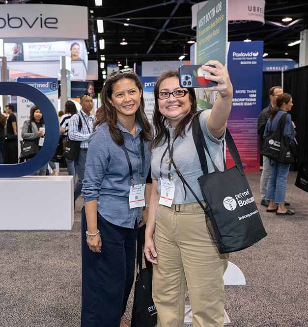 Two women taking selfies 