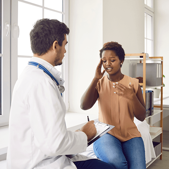 Patient with a headache visiting a doctor