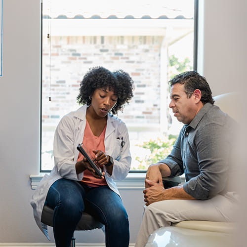 doctor talking to patient