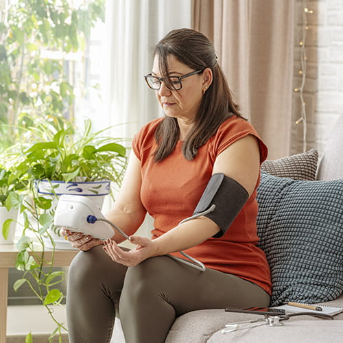 woman checking her blood pressure