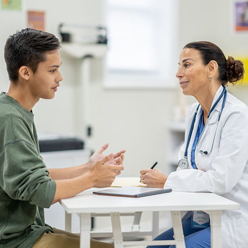 Doctor meeting with a teenager